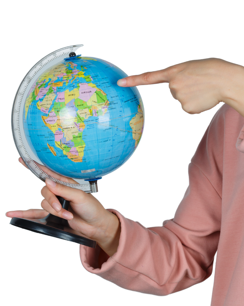 a female hand pointing on globe